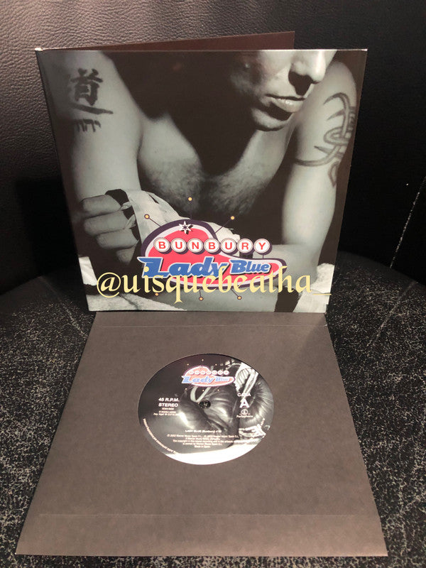 Enrique Bunbury : Lady Blue / Flamingos (7", Single, Ltd + CD, Album, RE)