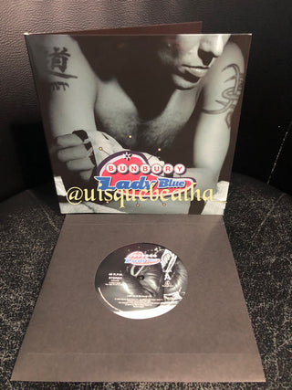 Enrique Bunbury : Lady Blue / Flamingos (7", Single, Ltd + CD, Album, RE)