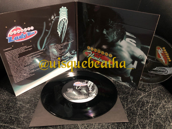 Enrique Bunbury : Lady Blue / Flamingos (7", Single, Ltd + CD, Album, RE)
