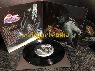 Enrique Bunbury : Lady Blue / Flamingos (7", Single, Ltd + CD, Album, RE)